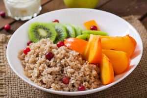 Porridge with fresh fruit and cranberries. Healthy breakfast. Proper nutrition. Dietary menu.