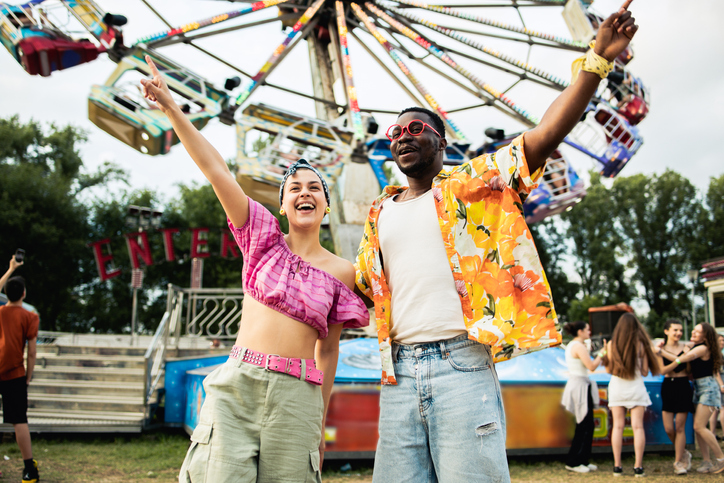 Young man and woman are having fun at the festival