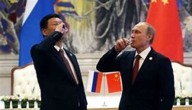 Putin and Xi sharing a drink