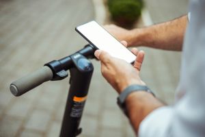 Cropped Image of Commuter with Smartphone