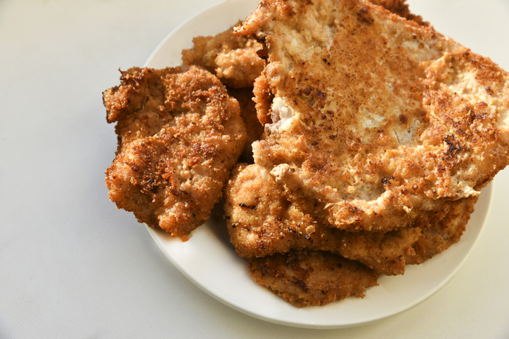 Pieces of fried pork meat on a plate