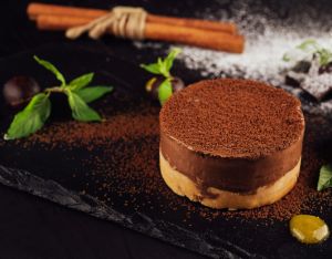 Mango and chocolate mousse on wooden black