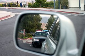 Police car in rear view mirror