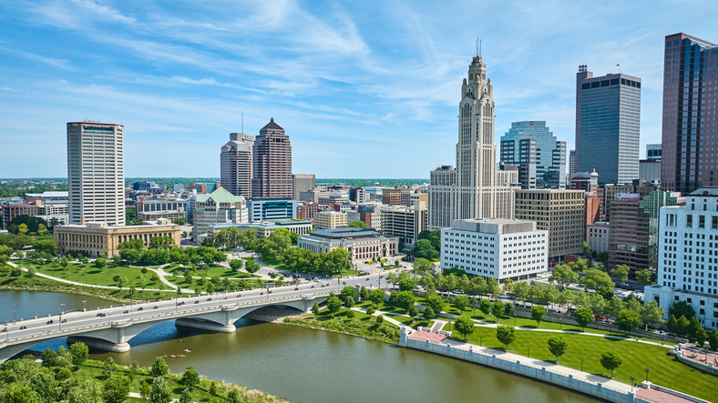 Aerial Columbus Ohio with bright blue sky with clouds and bridge over Scioto river