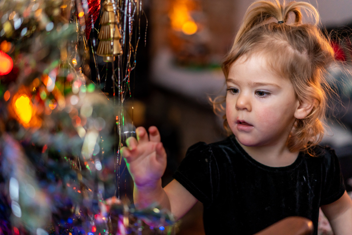 A young girl celebrating Christmas.