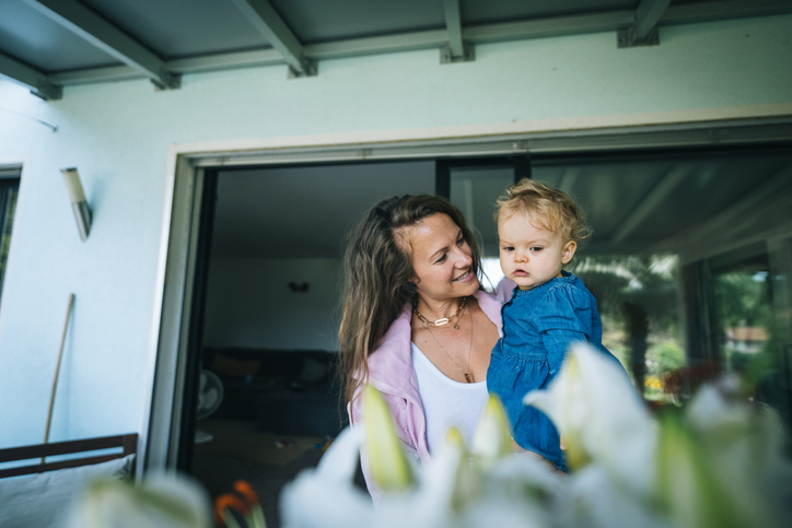 Mother and infant enjoy home patio