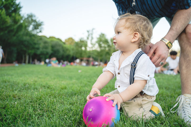 Baby boy playing at public park