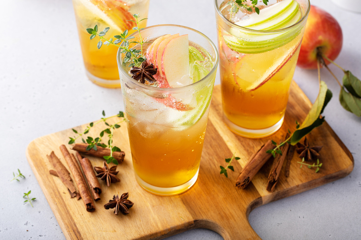 Refreshing fall cocktail, apple cider drink with apple slices and thyme