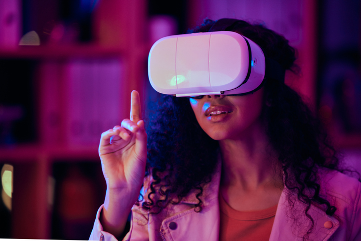 Woman, hand and virtual reality, press on screen with digital world and 3D, future technology and neon lighting. Experience, VR and metaverse, scifi or fantasy with simulation, gaming and holographic