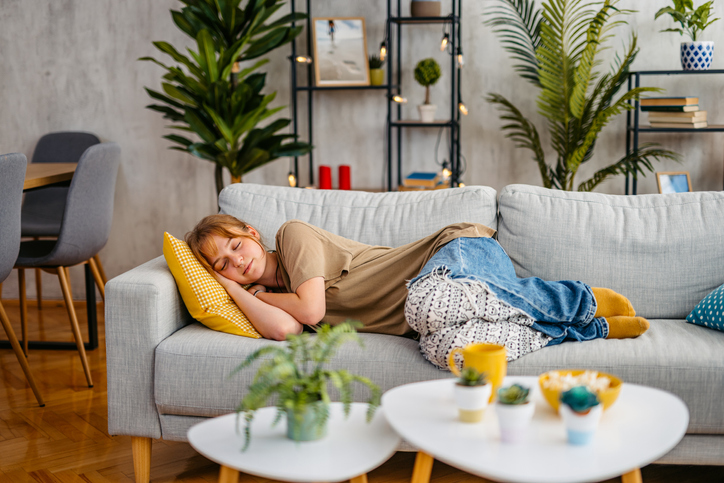 Young Woman Taking A Nap On The Sofa