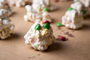 Red and green popcorn balls with chocolate and marshmallows