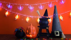 holidays image of Halloween. pumpkin and witch jars over wooden table