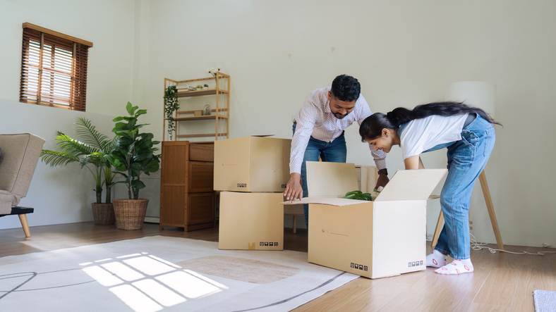 Married couple moving in new property bought together on mortgage loan