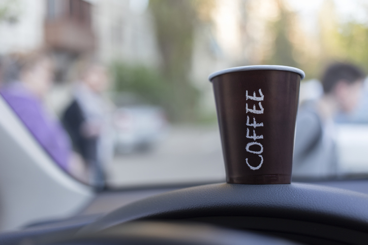 Close-up of disposable cup on car