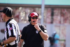 Indiana University's coach Tom Allen coaches against...