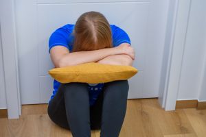 A lonely, broken woman cries after the loss of her partner