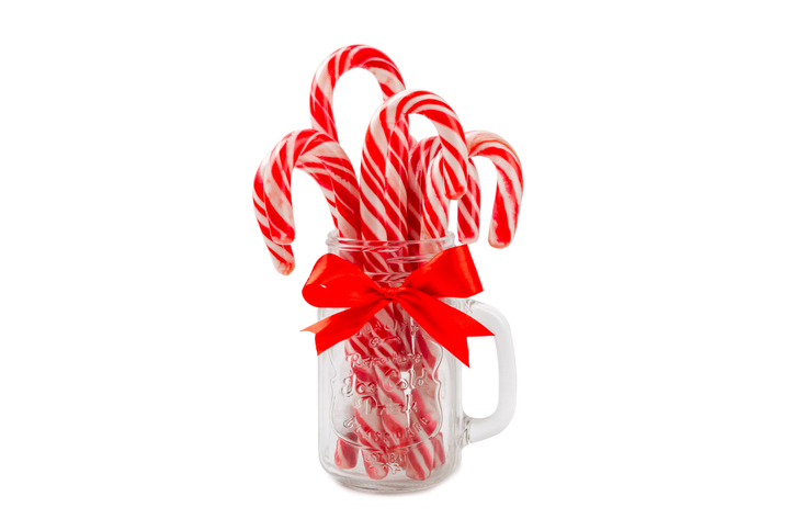 Candy cane isolated on white background. Christmas sweets. Christmas candy. New Year. A traditional sweet gift for the Christmas tree. Holiday concept.