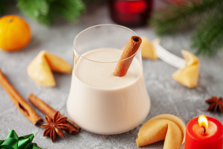 Traditional Christmas milk cocktail - Eggnog with cinnamon