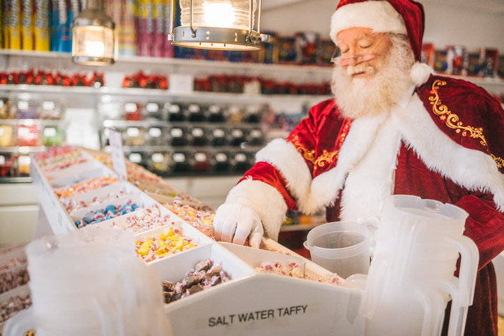 Santa Claus chooses candy in store