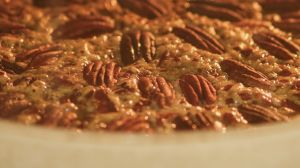 Baking process of pecan pie in home oven in kitchen