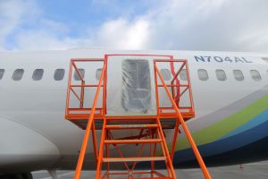 NTSB Investigates Alaska Airlines Flight 1282 After Section Of Plane Blew Off During Flight