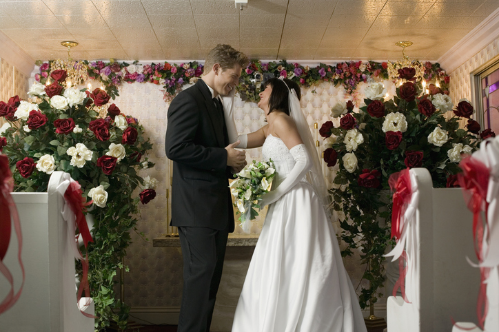 Bride and groom standing face to face at an altar, Las Vegas, Nevada