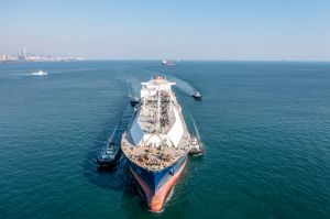 Drone Point View of A LNG Tanker is Sailing in front of Qingdao City Skyline