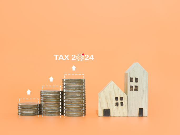 Miniature house, stack of coins with virtual increasing graph. The concept of prices for house, Property investment, House mortgage, Real estate and and manage to paying tax in year 2024