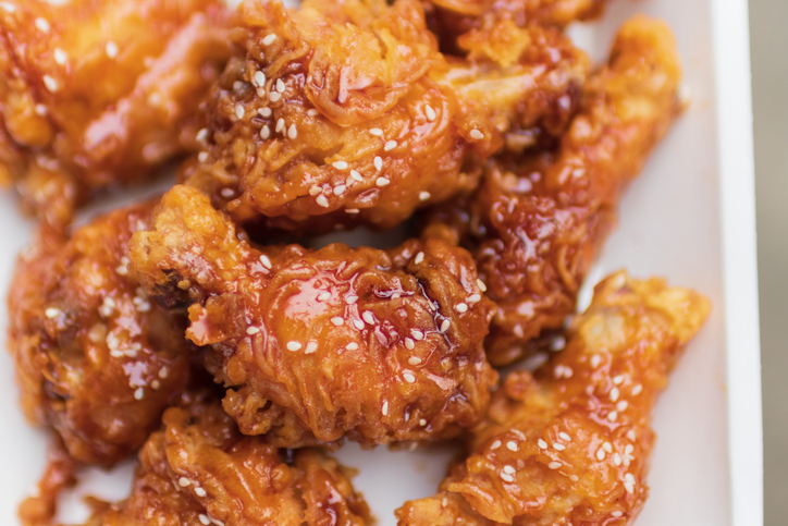 Deep fried chicken wing with spicy sauce in Korean style.