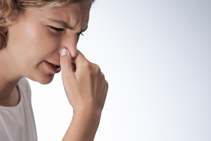 Strong Disgust Smell Bad Breath of Suffering Woman in Studio