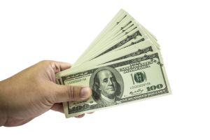 Man hand holding dollar money isolated on white background with clipping path.