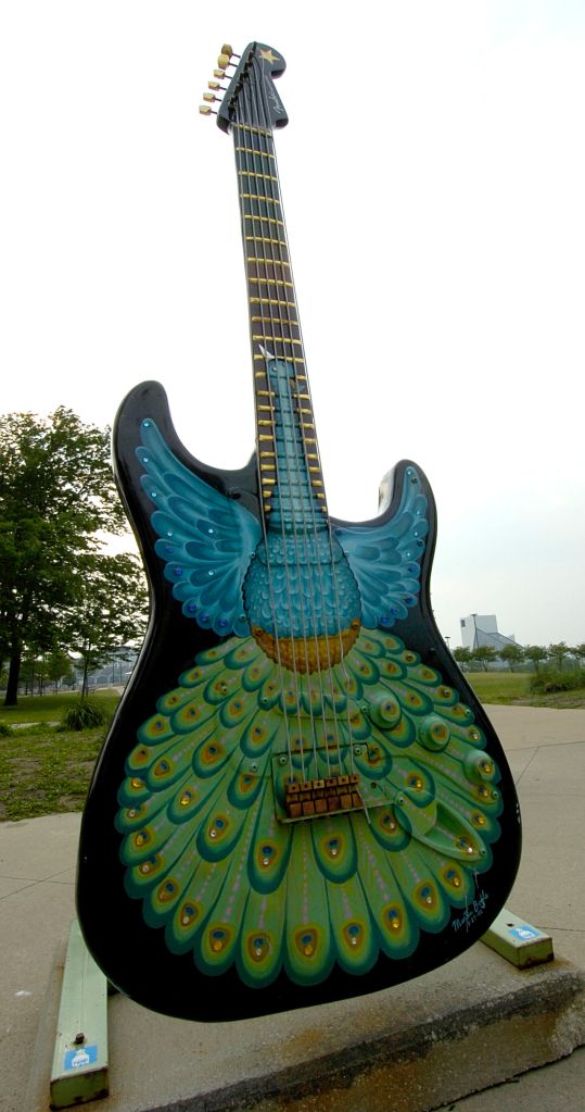 (6/18/06 -Cleveland, Ohio) 061806guitarap01.jpg A guitar sculpture stands in a park near the Rock n' Roll Hall of Fame and Museum(seen at right, rear).Staff photo by Arthur Pollock - saved in adv travel and photo 01