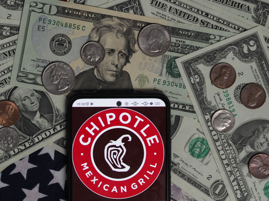 In this photo illustration, a Chipotle Mexican Grill logo...