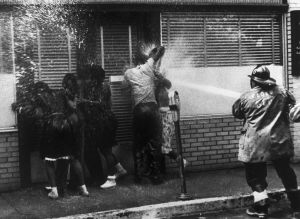 Protesters Being Hosed by Fireman