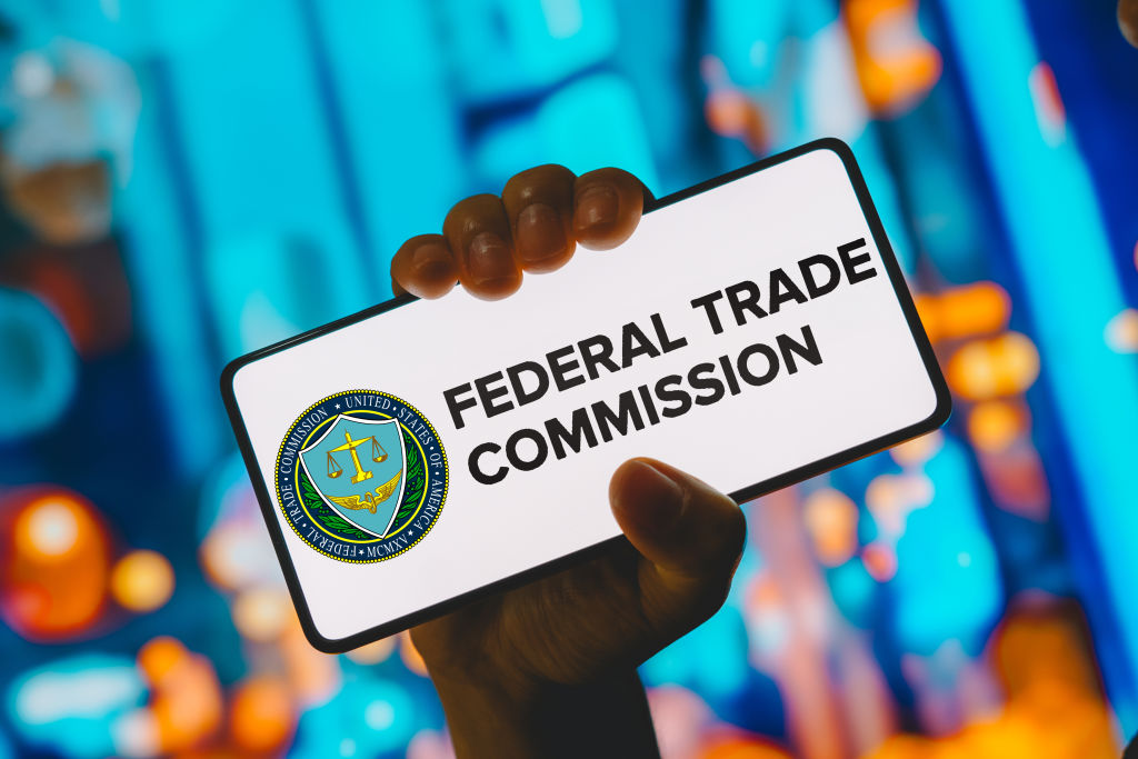 In this photo illustration, the Federal Trade Commission (...