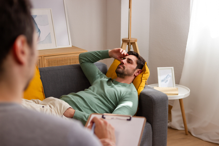 Man in therapy session with psychologist