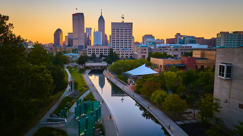 Aerial Sunset Glow on Indianapolis Skyline and Canal Reflections