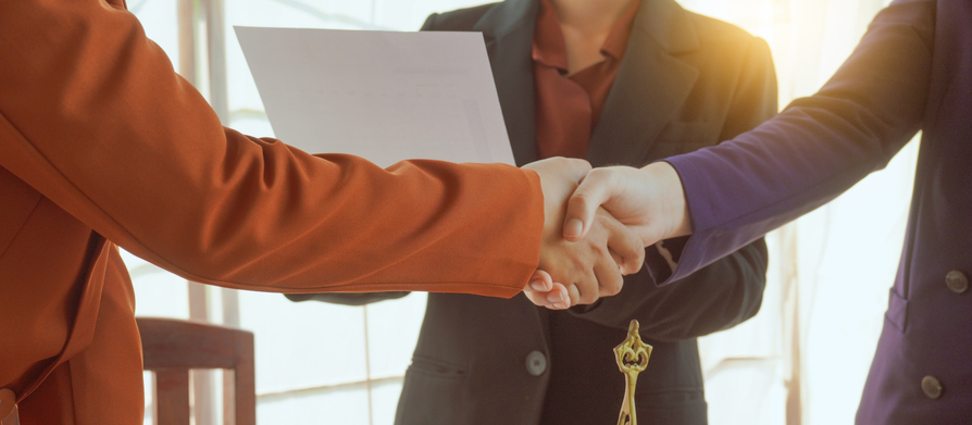 Shaking hands, A group of lawyers and clients engage in a professional meeting at a law office, discussing agreements, contracts, and legal matters with a focus on justice and expert advice.