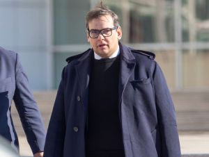 Former Congressman George Santos arrives at Long Island courthouse