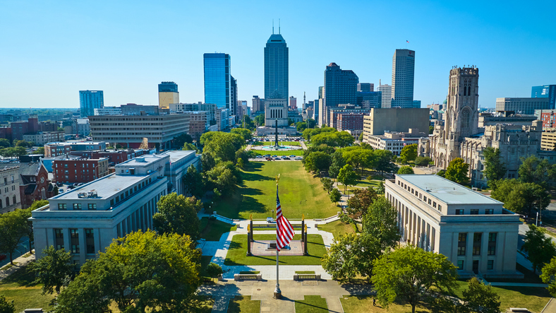 Aerial View of Urban Park with American Flag and City Skyline