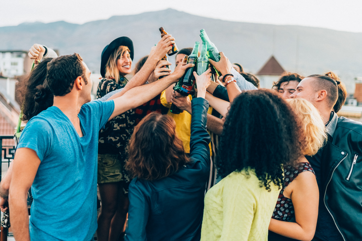 Friends drinking and partying on the rooftop
