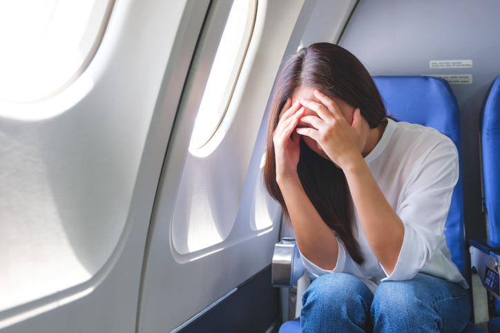 A plane is probably the worst place to get sick