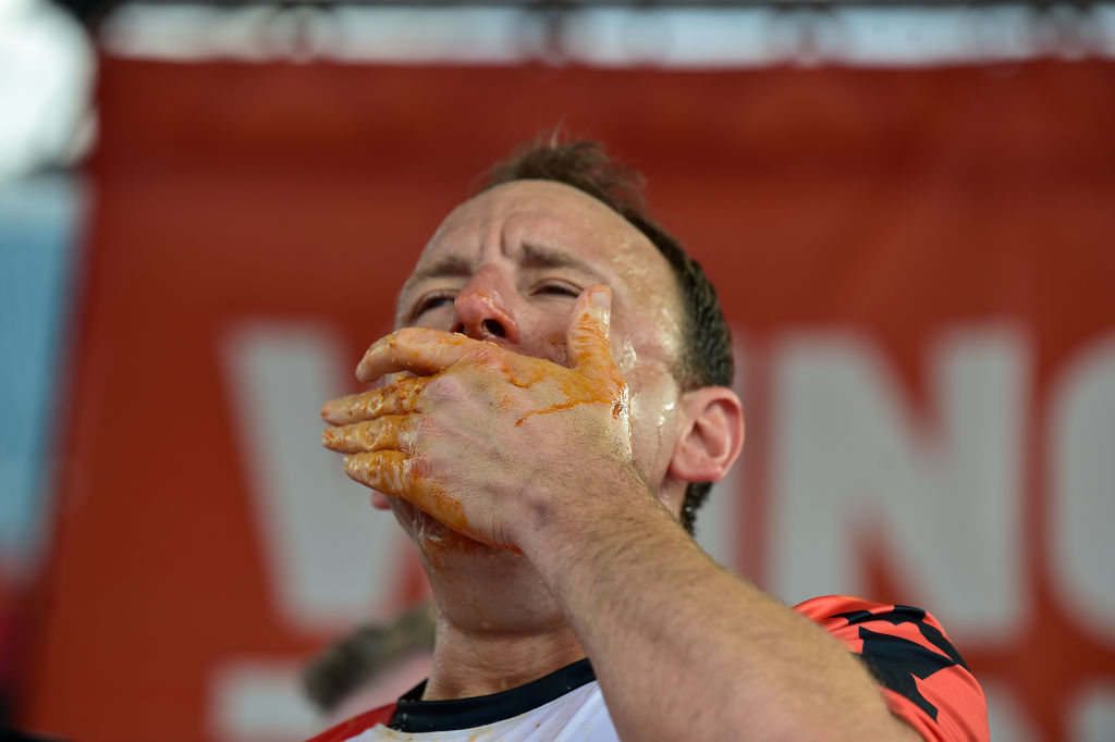 Joey Chestnut shows no rust as he downs 57 hot dogs in competition at Fort Bliss