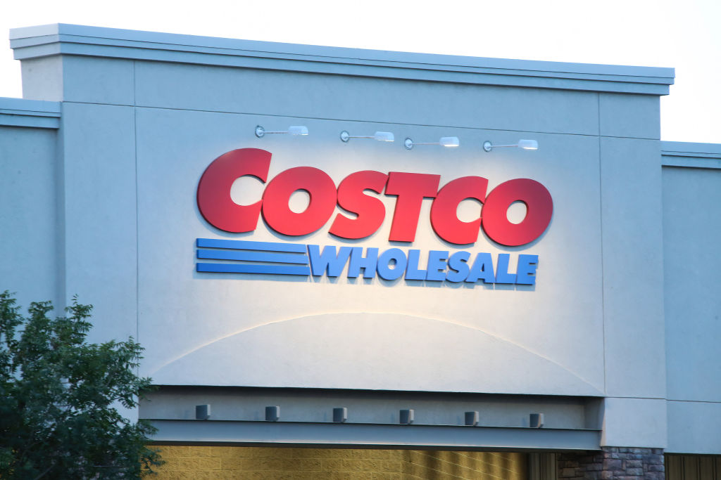 A Costco Wholesale Corporation logo is seen displayed on the...