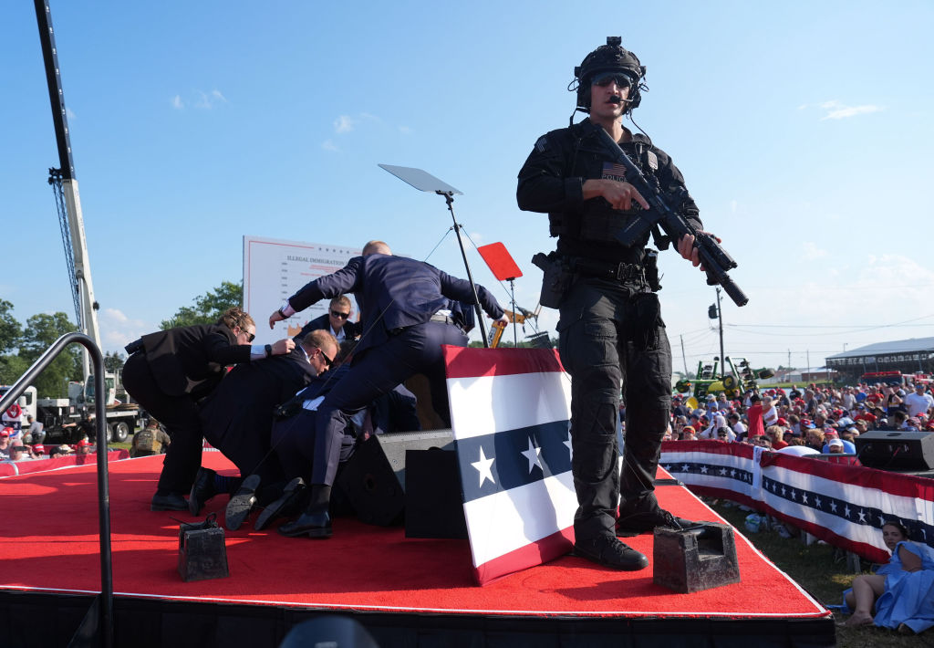 BUTLER, PENNSYLVANIA - July 13: Secret service agents cover for