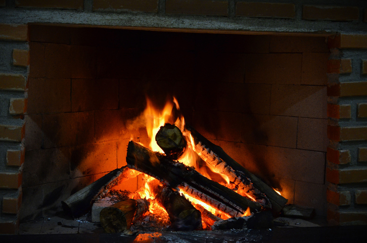 Embers of fire in the fireplace wood