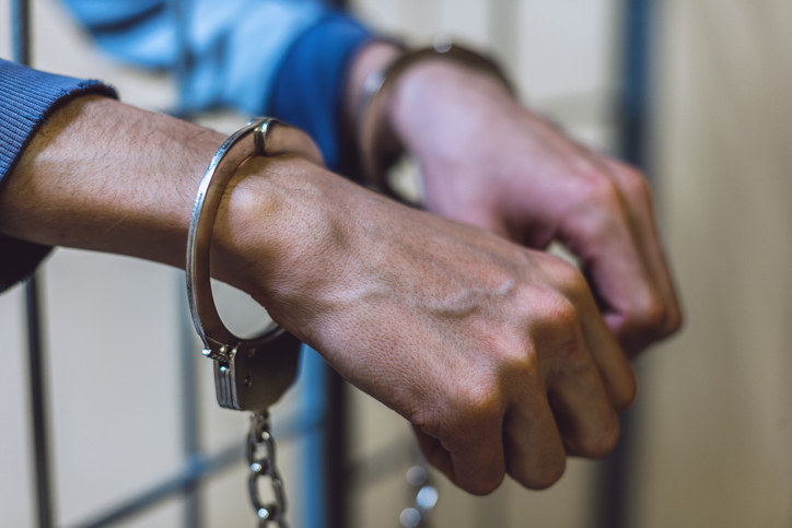 Close-Up Of Human Hand With Handcuffs
