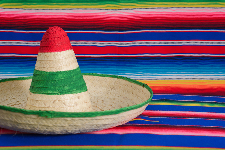 Mexican hat with the colors of the Mexican flag on a colorful serape.