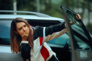Woman Suffering from Severe Car Sickness