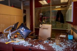 Windows are seen smashed at the First Financial bank...